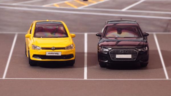 still from stop motion animation of two cars